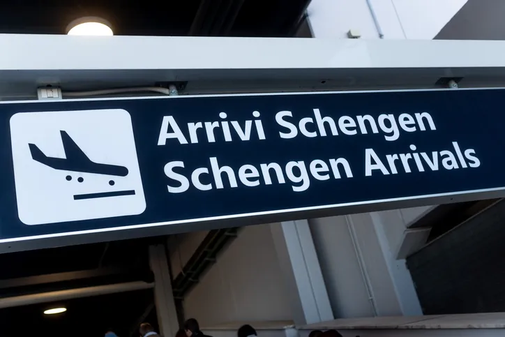 A sign indicates the entrance for passengers with Schengen passports from the European Union