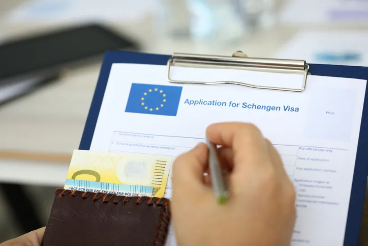 Man filling questionnaire form stock photo