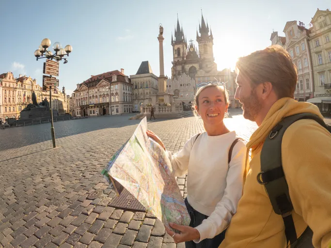 Young couple exploring the city and the famous landmark. Prague, Czech Republic