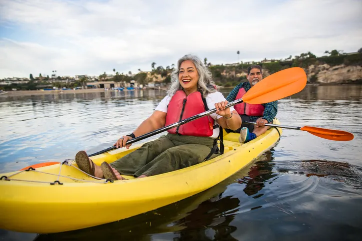 A beautiful senior Hispanic couple kayaking