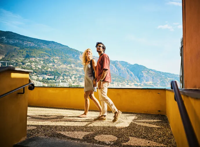 Young couple enjoying their trip to Menton, while travelling in the south of France.