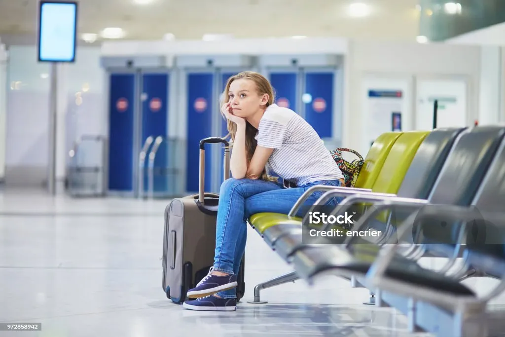 Woman in the international airport waiting for her flight